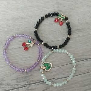 Set of Three Beaded Bracelets with Charms